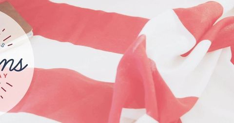 Red and white striped fabric knot with pink badge, minimal high-key soft textile