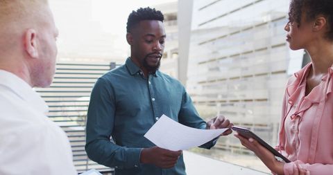 Diverse Team Discussing in Modern Office Setting
