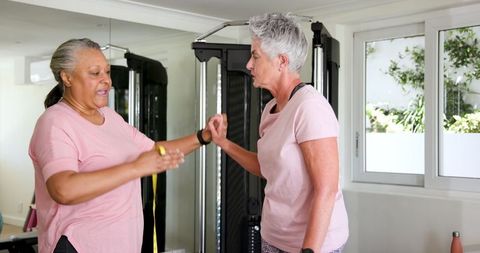 Senior Couple Enjoying Home Workout with Fitness Equipment