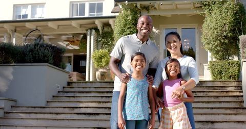 Happy Family Bonding Outside Modern Home