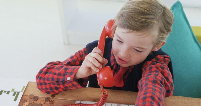 Kid Talking on Red Vintage Phone in Office Atmosphere - Download Free Stock Images Pikwizard.com