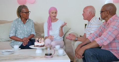 Senior Friends Celebrating Birthday with Cake and Conversation