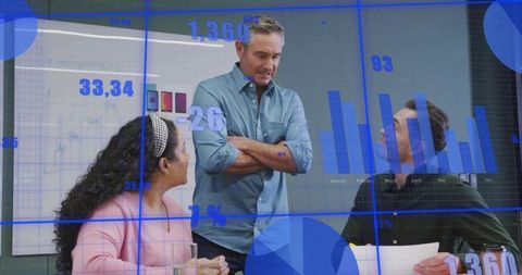 Manager Presenting Data to Team in Boardroom with Digital Charts and Discussion