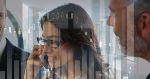 Professionals Collaborating on Financial Analysis with Trading Charts