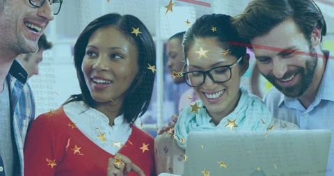 Diverse professionals collaborating around a laptop