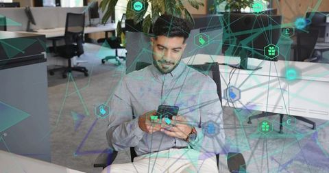 Indian Professional Exploring Digital Connectivity in Modern Office