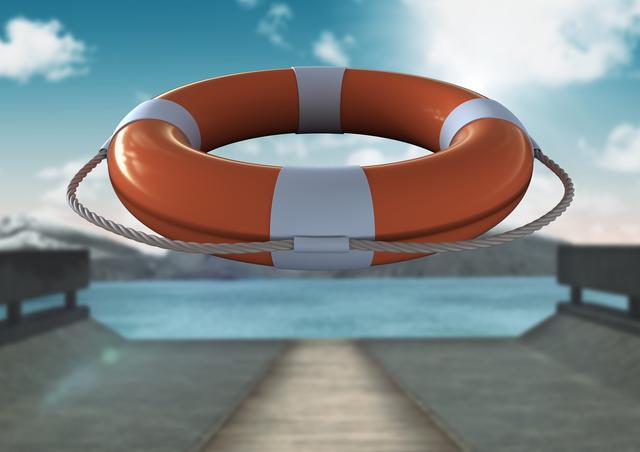 Lifebuoy floating in mid-air over a pier on a sunny day with a clear sky and mountains in the background. Useful for safety, rescue, and emergency prevention themes. Can be used in water safety campaigns, educational materials, or maritime publications.