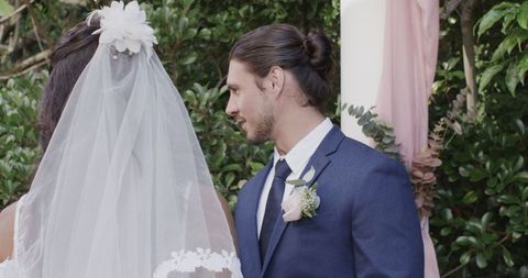Bride and Groom Having Emotional Outdoor Wedding Ceremony