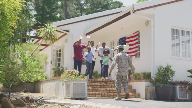 This video captures a touching moment of a soldier reuniting with his family in a sunny garden setting. The children's excitement and patriotic spirit are evident as they wave American flags. This video can be used to depict themes of military family life, patriotic celebrations, or military homecomings. Suitable for websites, advertisements, or articles focused on the military, family values, and reunions.