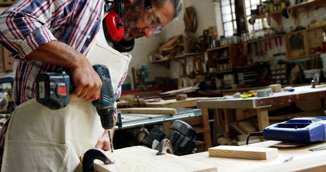 Carpenter Using Power Drill in Workshop - Download Free Stock Images Pikwizard.com