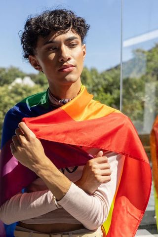 Fashionable Individual in Pride Flag Embracing Self Identity