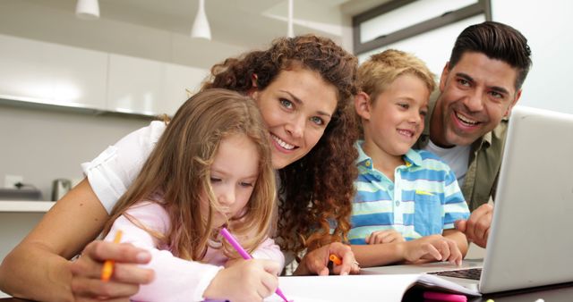 Happy Family Spending Time Together Using Laptop in Kitchen - Download Free Stock Images Pikwizard.com