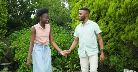 Happy African American Couple Enjoying Romantic Time in Garden