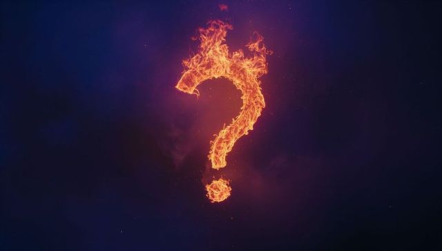 Fiery Question Mark Flickering in Smoky Void