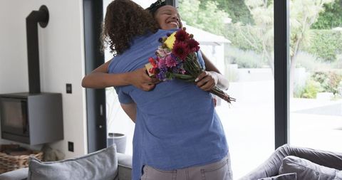 Romantic Surprise: Gift of Flowers in Heartwarming Reunion