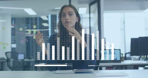 Businesswoman Analyzing Data with Digital Graph Interface - Download Free Stock Images Pikwizard.com