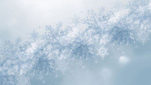 Gliding frosty garland of crystal snowflakes sweeping across pale blue winter background
