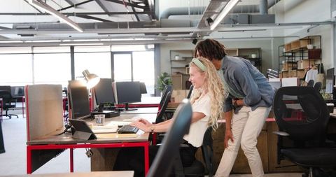 Colleagues Celebrating Success with High Five in Office