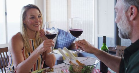 Mature Couple Enjoying Dinner with Wine at Home - Download Free Stock Images Pikwizard.com