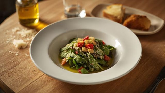 Healthy Green Salad with Olive Oil Drizzling and Fresh Vegetables