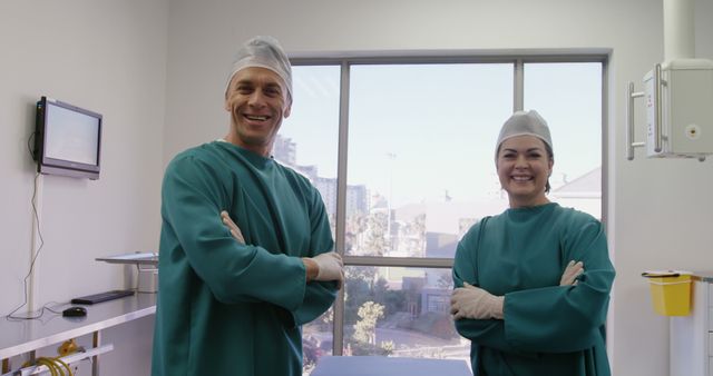 Smiling Surgeons in Surgical Attire Standing in Hospital Room - Download Free Stock Images Pikwizard.com