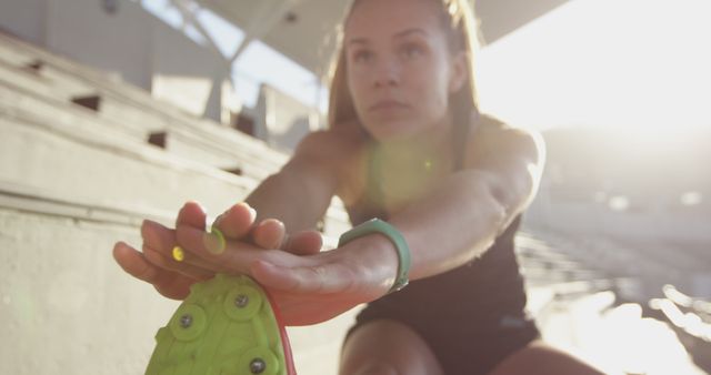 Female Athlete Stretching on Track at Sunrise for Morning Workout - Download Free Stock Images Pikwizard.com