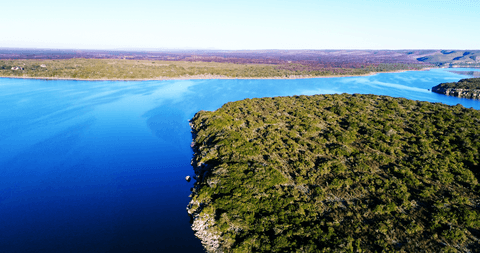 transparent blue river winding through lush landscapes - Download Free Stock Videos Pikwizard.com