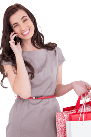 Smiling woman carrying shopping bags using transparent background