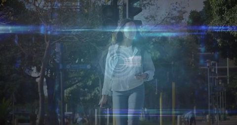 Woman with Luggage Crosses Street Checking Smartphone
