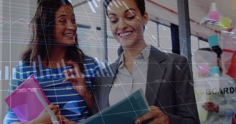 Diverse Businesswomen Analyzing Financial Data with Digital Interface - Download Free Stock Images Pikwizard.com