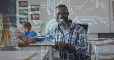Black male teacher smiling and guiding students using tablet with ar learning overlay