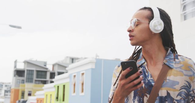 Man Listening to Music on Headphones Outdoors - Download Free Stock Images Pikwizard.com