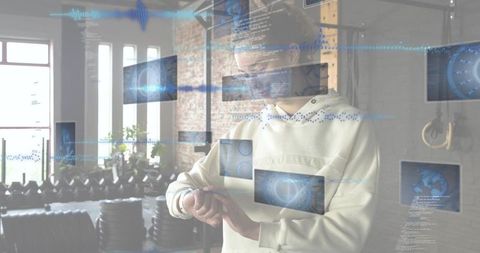 Athlete adjusting wearable in gym with floating augmented reality fitness interface