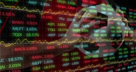 Financial Market Data Overlaying Soccer Player Holding Ball