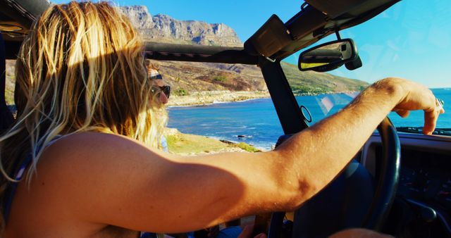 Young Man Enjoying Scenic Drive along Coastal Highway - Download Free Stock Images Pikwizard.com