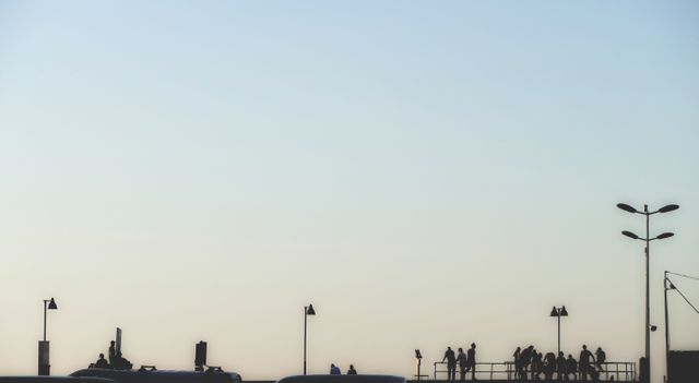 Silhouetted People Against Clear Sky at Sunset - Download Free Stock Images Pikwizard.com