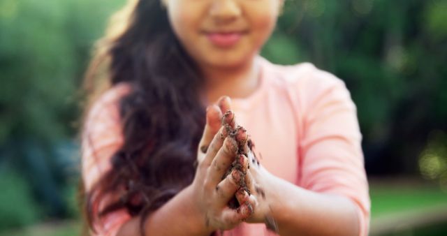 Young Girl Playing with Mud Outdoors - Download Free Stock Images Pikwizard.com