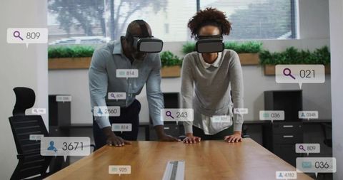 Collaborating in virtual reality with floating data overlays at wooden conference table