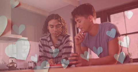 Diverse Gay Couple Sharing Fruit in Heartful Kitchen