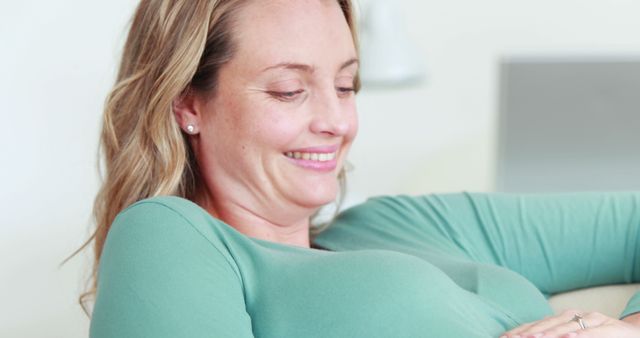 Happy Pregnant Woman Smiling and Touching Belly - Download Free Stock Images Pikwizard.com