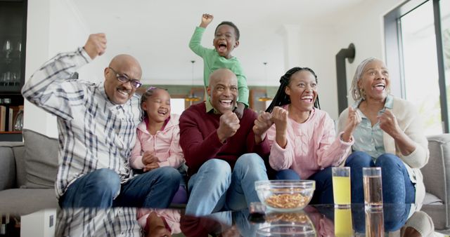 Cheerful African American Family Celebrating Victory Together at Home - Download Free Stock Images Pikwizard.com