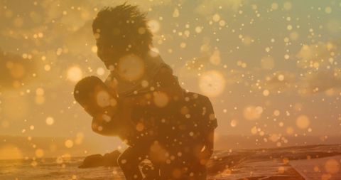 Joyful Couple on Beach with Illuminated Bokeh overlay