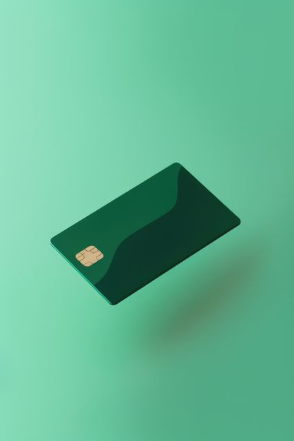 Blank green credit card with microchip on green, copy space, created using generative ai technology. Emv chip, banking, spending, technology and finance mock up concept digitally generated image.