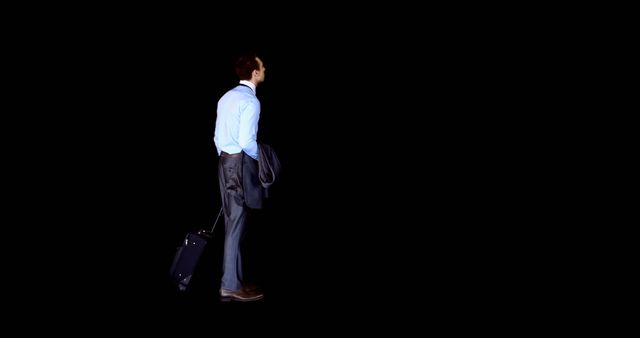 Businessman with Luggage Looking Forward in Black Background - Download Free Stock Images Pikwizard.com