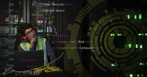 Network analyst strategizing laptop in data center