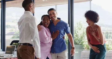 Excited Colleagues Celebrating Success in Innovative Office