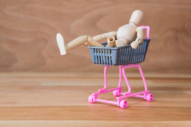 Conceptual image of baby figurine lying in a pram