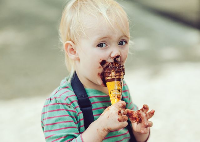 Cute Toddler Eating Chocolate Ice Cream Messily - Download Free Stock Photos Pikwizard.com