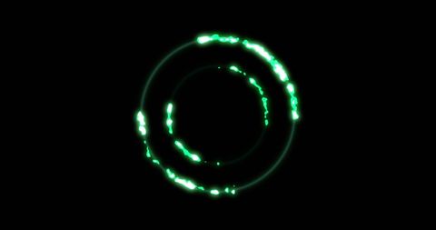 Glowing green circular patterns on black background