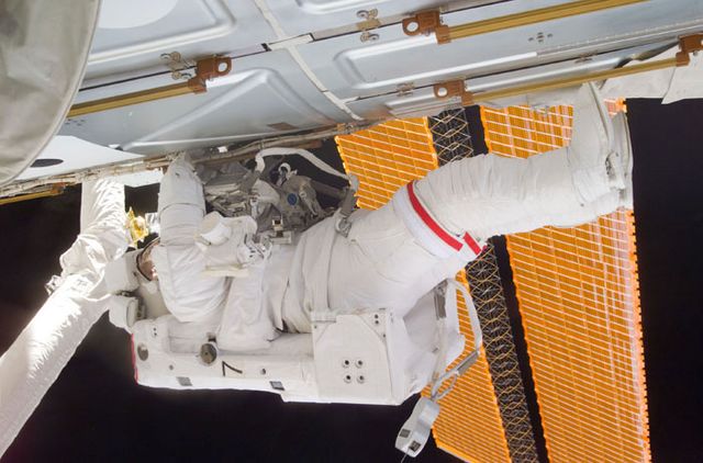 Astronaut Thomas D. Jones seen conducting maintenance work during a spacewalk mission on the International Space Station (ISS). Image captured in February 2001 from Space Shuttle Atlantis. Perfect for use in articles and publications related to space missions, astronaut training, and space exploration research.